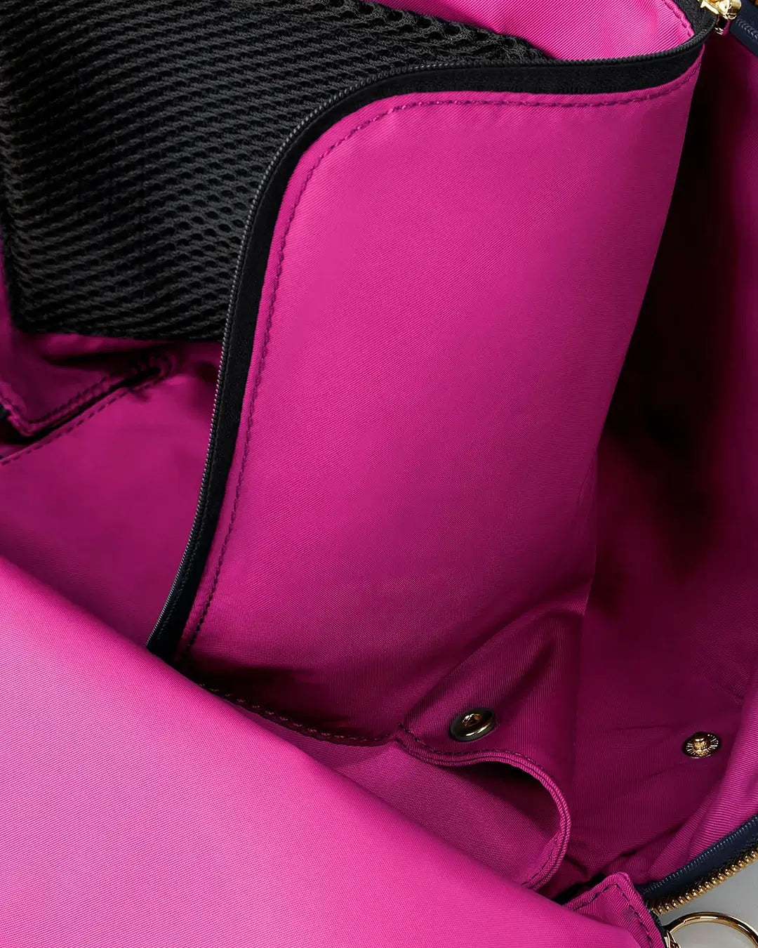 Close-up of a pink bag with black interior lining