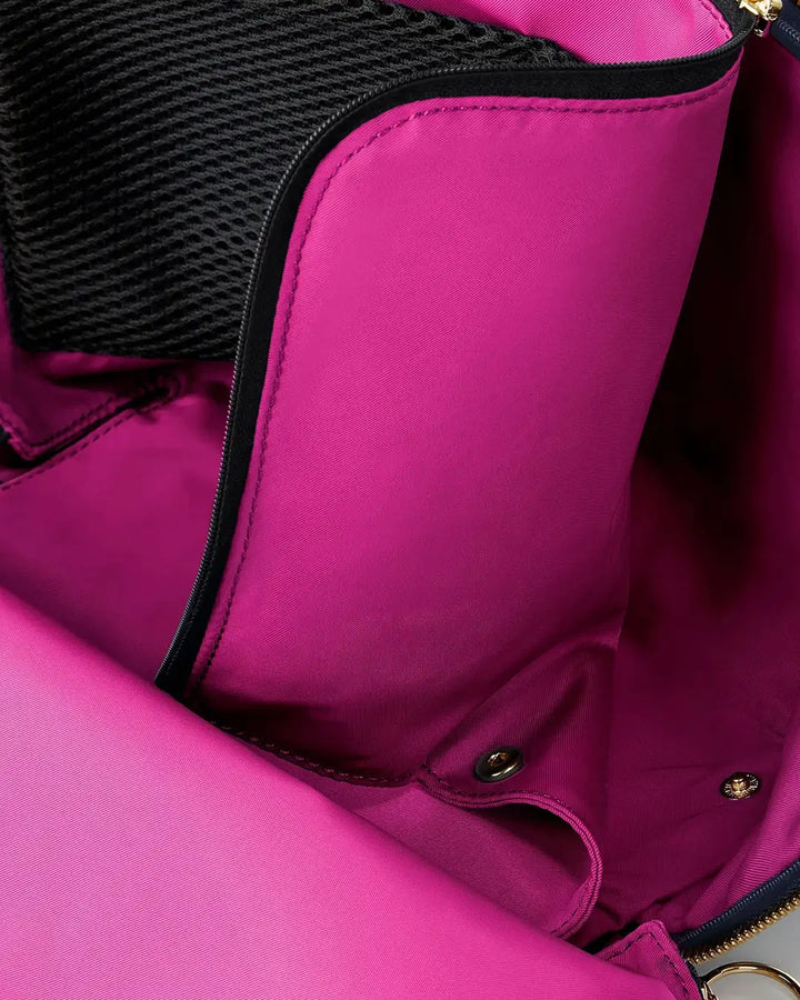 Close-up of a pink bag with black interior lining