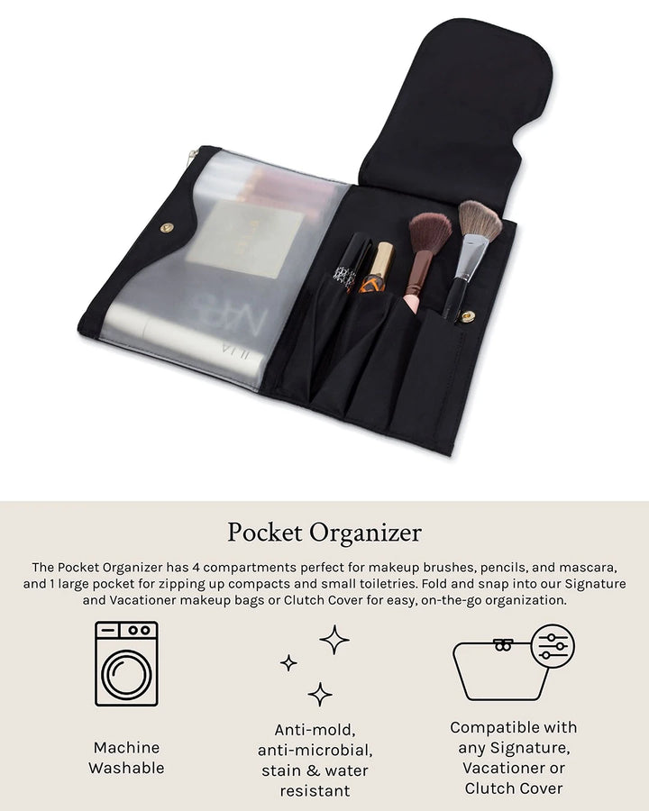 Black pocket organizer with makeup brushes and compact on a white background