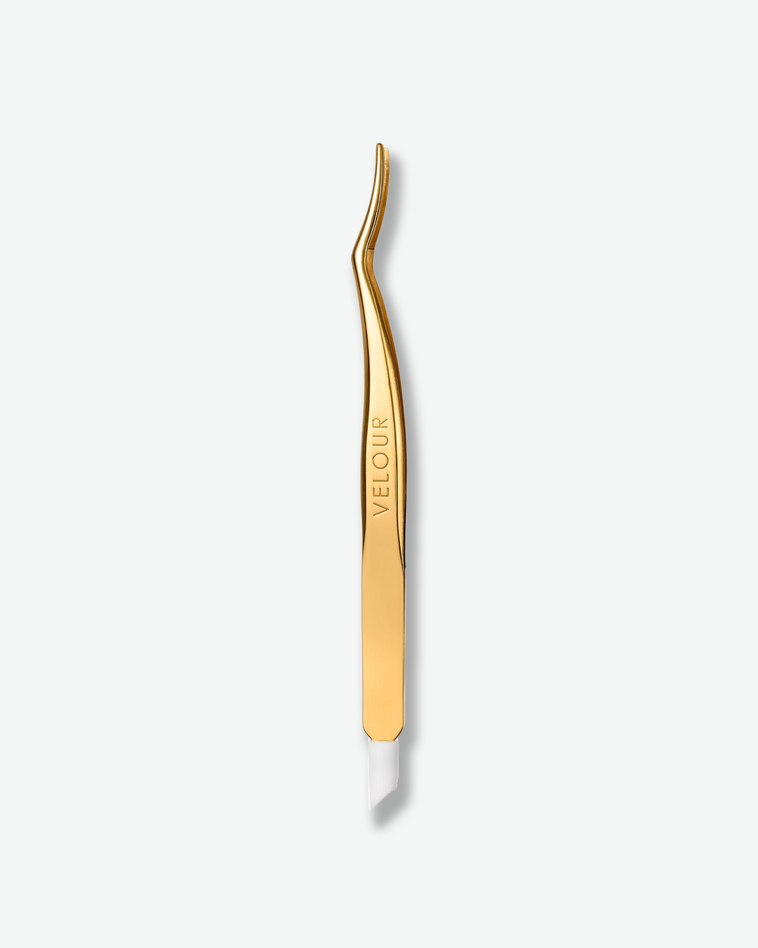 Front view of a pair of gold lash extension tweezers standing vertically against a plain gray background. The curved applicator tool features a polished, high-shine gold finish engraved with the brand name "VELOUR" along the handle, terminating in a white silicone protective tip at the base.