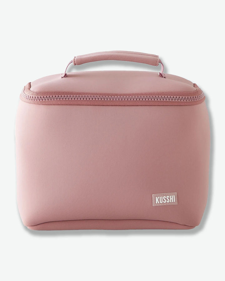 Pink cosmetic bag with 'Kusshi' logo on a white background