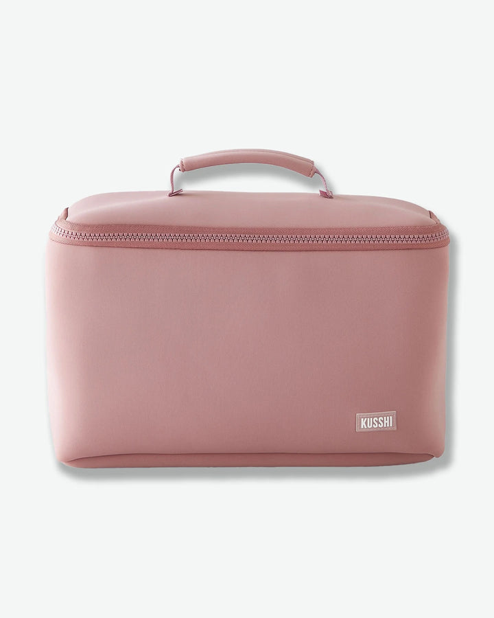 Pink cosmetic bag with 'Kusshi' brand logo on a white background