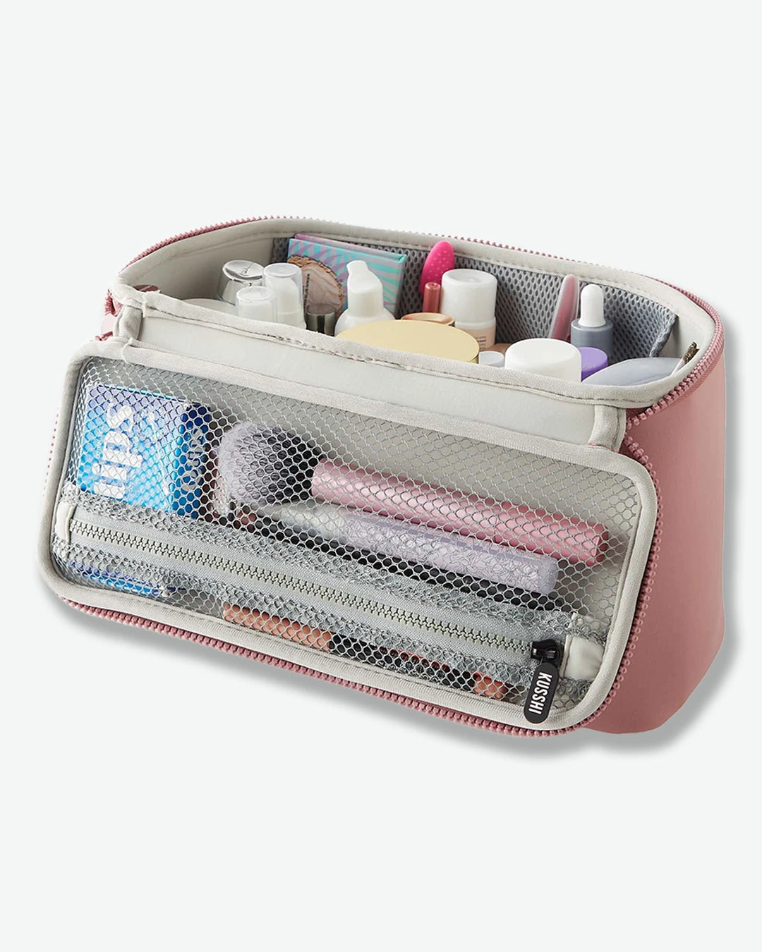 Pink travel toiletry bag with organized compartments on a white background