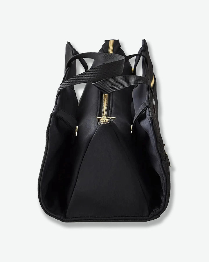 Black backpack with gold zipper on a white background
