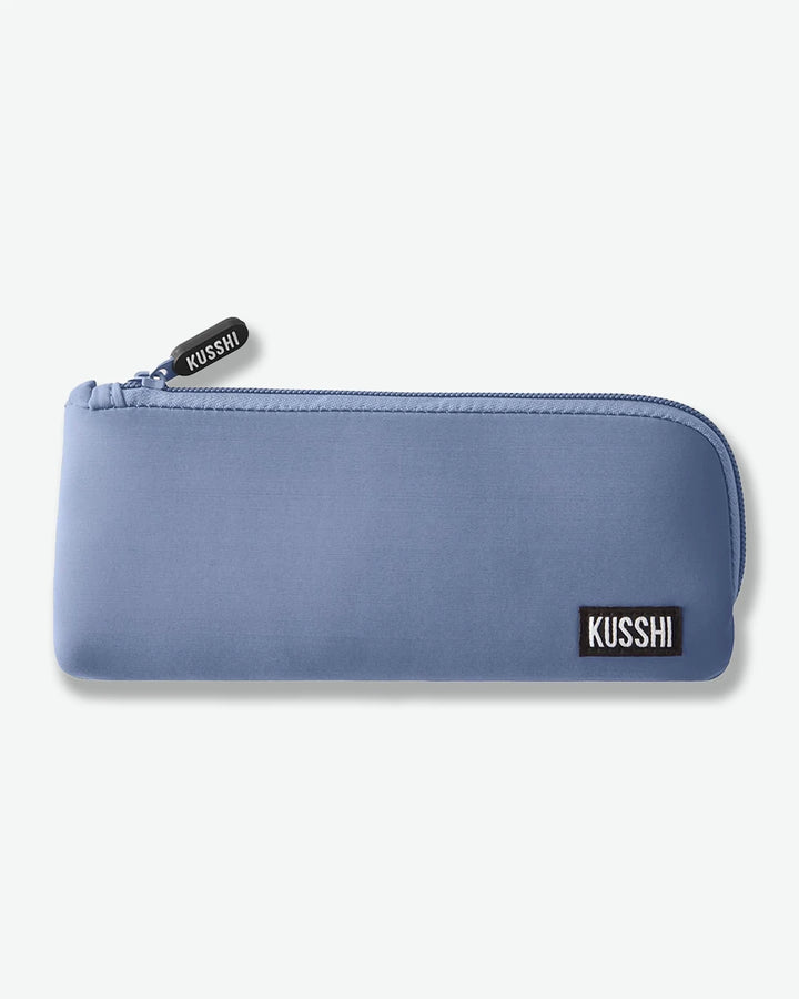 Blue pouch with 'Kusshi' branding on a white background
