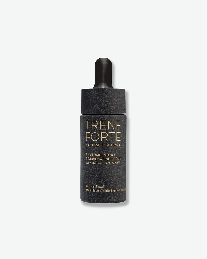 A product shot of a Irene Forte Phytomelatonin Rejuvenating Serum bottle standing next to its textured dark gray packaging box, centered on a light gray background. The cylindrical serum bottle features a matte dark gray speckled texture with elegant gold lettering and is fitted with a black rubber dropper cap. The matching dark gray rectangular box also features gold typography detailing the product information.