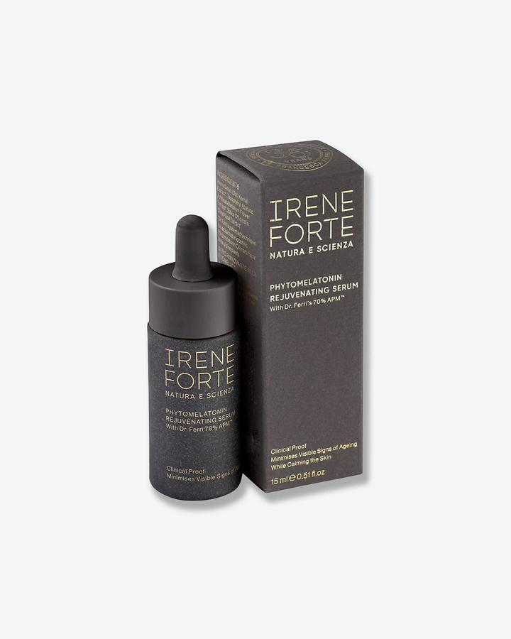 A product shot of a closed Irene Forte Phytomelatonin Rejuvenating Serum bottle, centered against a plain light gray background. The cylindrical container has a matte dark gray speckled finish with the brand name "IRENE FORTE" and product details printed in fine gold lettering on the front. It is topped with a matte black dropper assembly and a black rubber bulb.