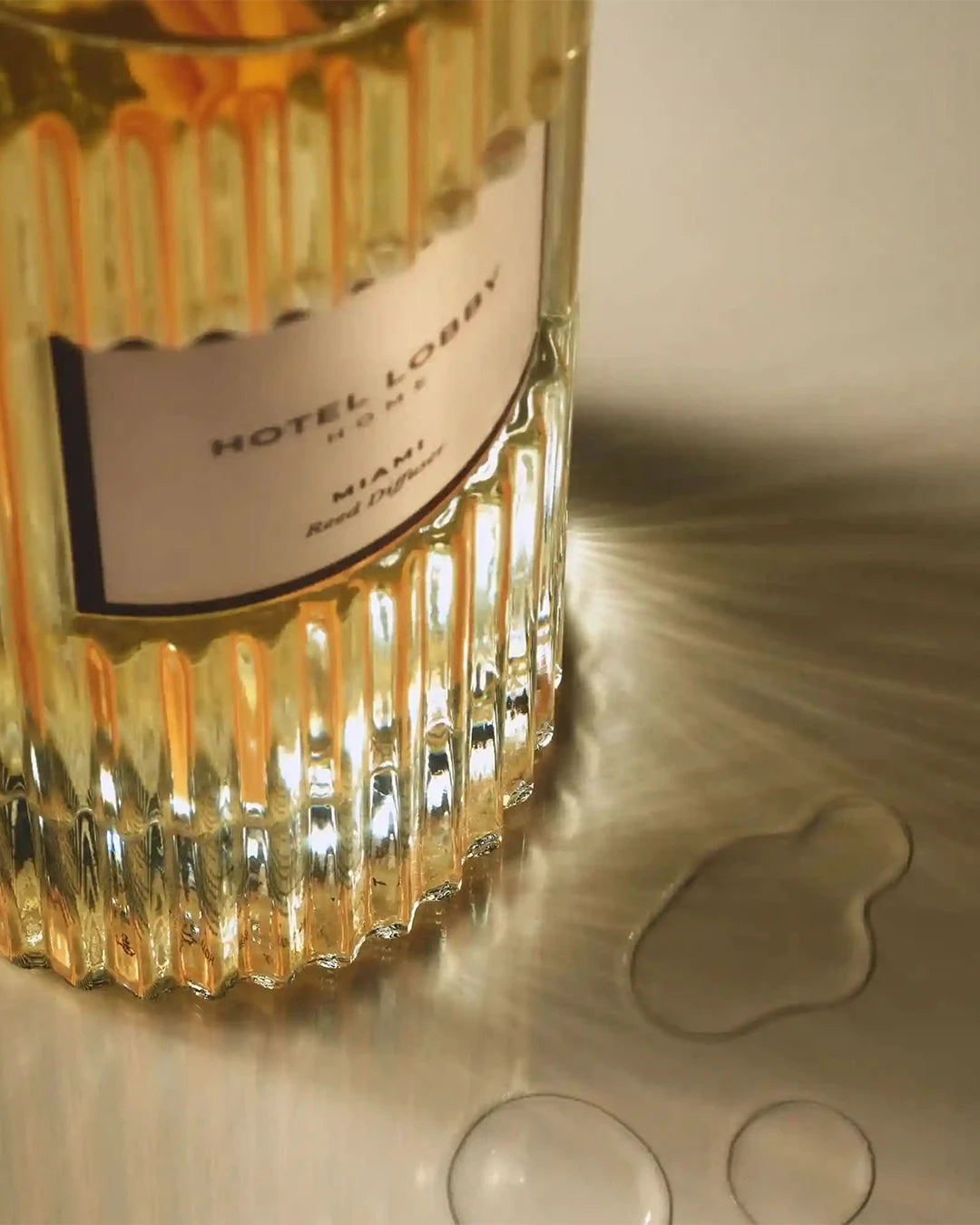 Bottle of Hotel Lobby Miami bottle on a reflective surface