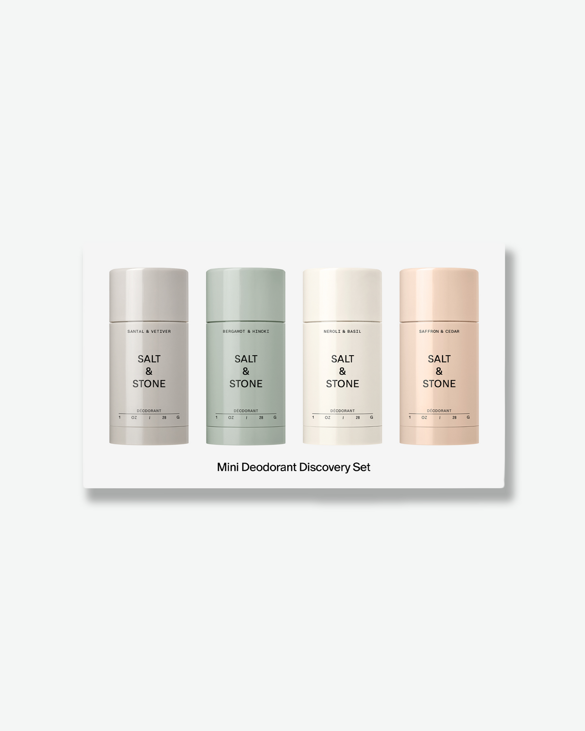 Salt & Stone Mini Deodorant Discovery Set featuring four small deodorant sticks in grey, sage green, cream, and blush pink lined up in a white box.