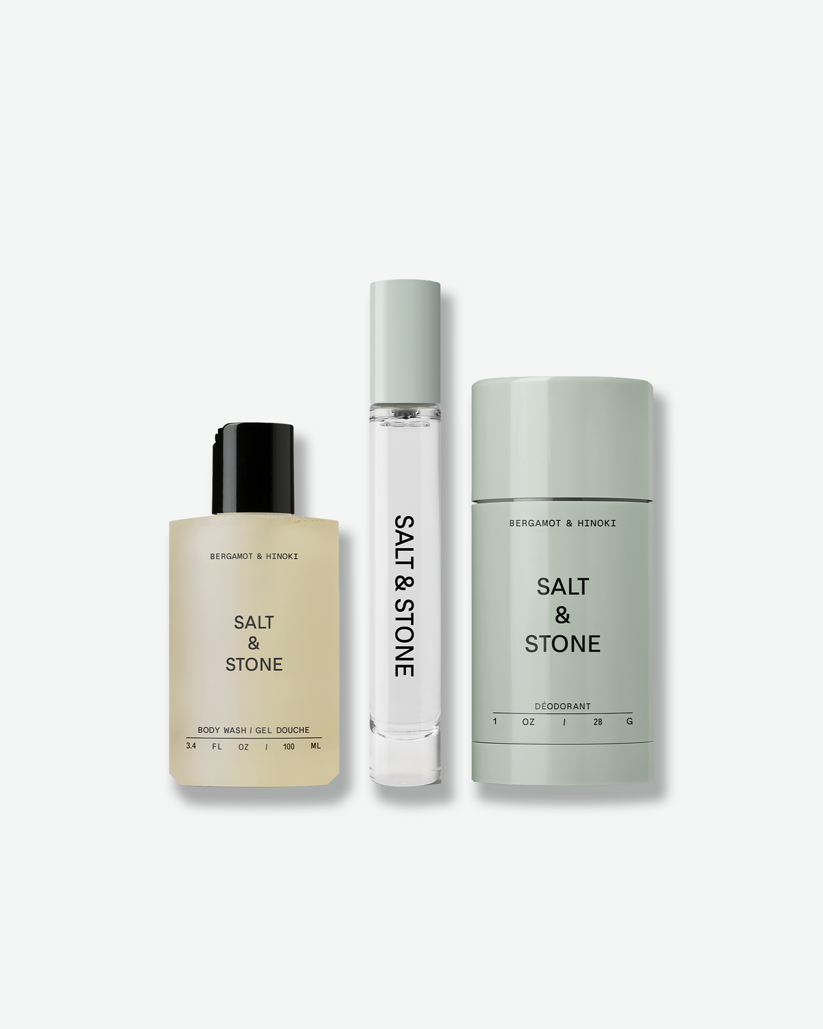 SALT & STONE Bergamot & Hinoki Signature Trio featuring body wash, body mist, and deodorant in minimalist neutral packaging on a light gray background.