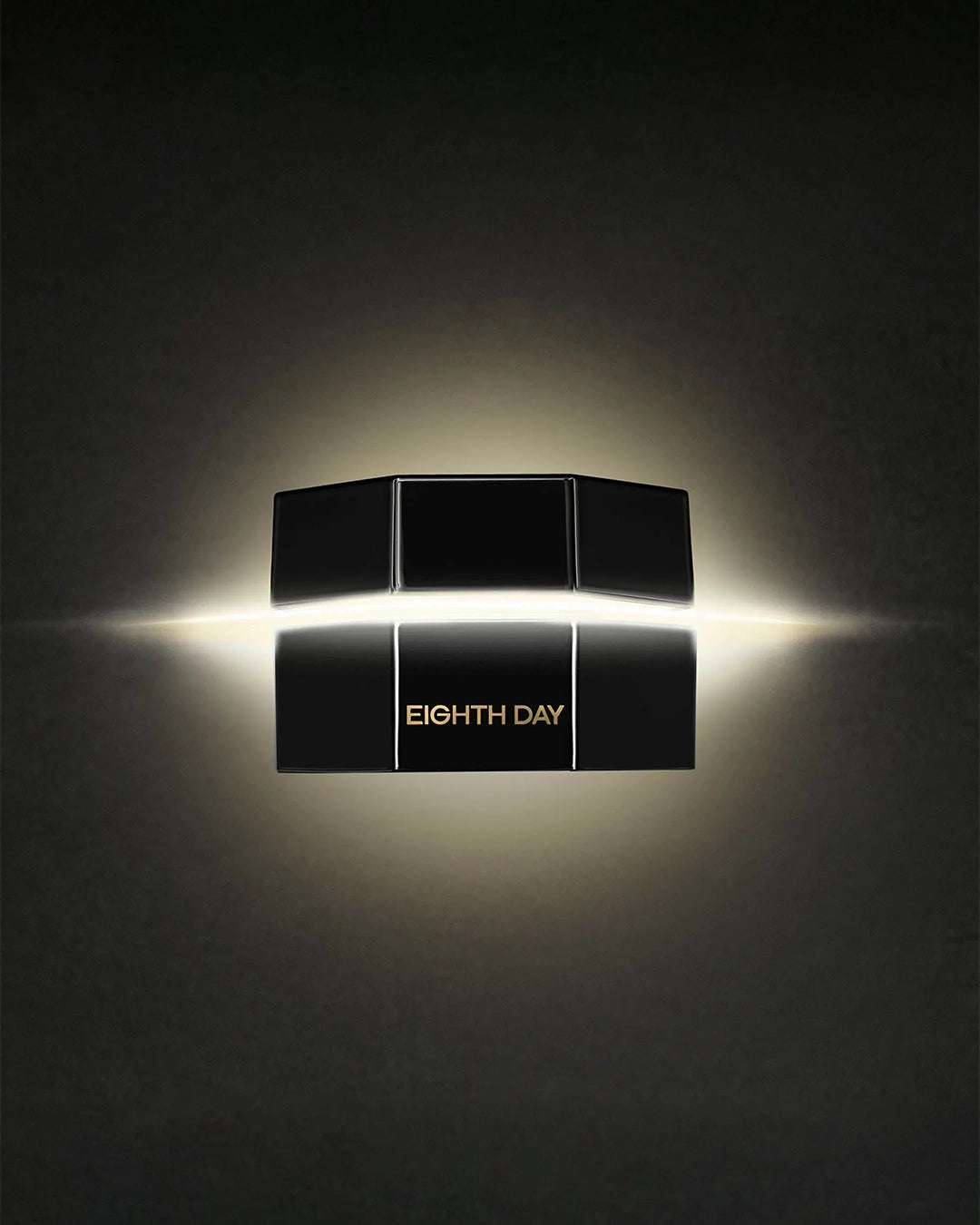 Black cosmetic product packaging with 'Eighth Day' branding on a dark background