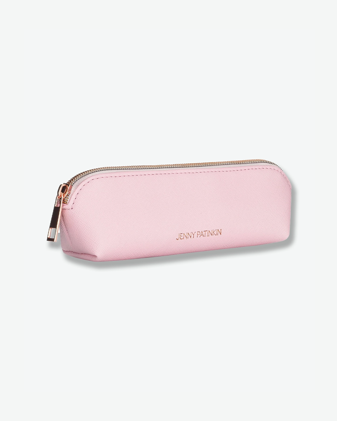 A product shot of a small, slim pink cosmetic case angled against a plain light gray background. The rectangular pouch is crafted from textured pink saffiano leather and features "JENNY PATINKIN" written in small gold letters on the front, secured with a rose-gold zipper along the top.