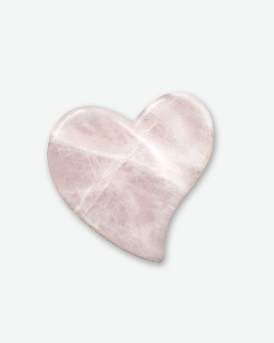 A top-down product shot of a polished rose quartz gua sha tool, centered against a plain light gray background. The stone is carved into an elegant, smooth heart shape with gentle curves and features a milky pink hue with pale white veining and a glossy finish that catches the light along its edges.