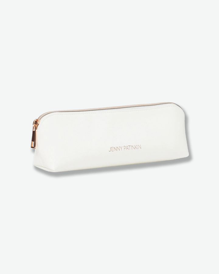 A product shot of a small, slim off-white cosmetic case angled against a plain light gray background. The rectangular pouch is crafted from textured faux leather and features "JENNY PATINKIN" written in small rose-gold letters on the front, secured with a matching rose-gold zipper along the top.