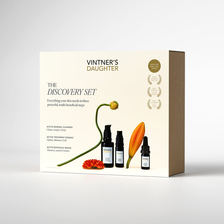 Vintner's Daughter skincare discovery set packaging with bottles and floral elements on a white background