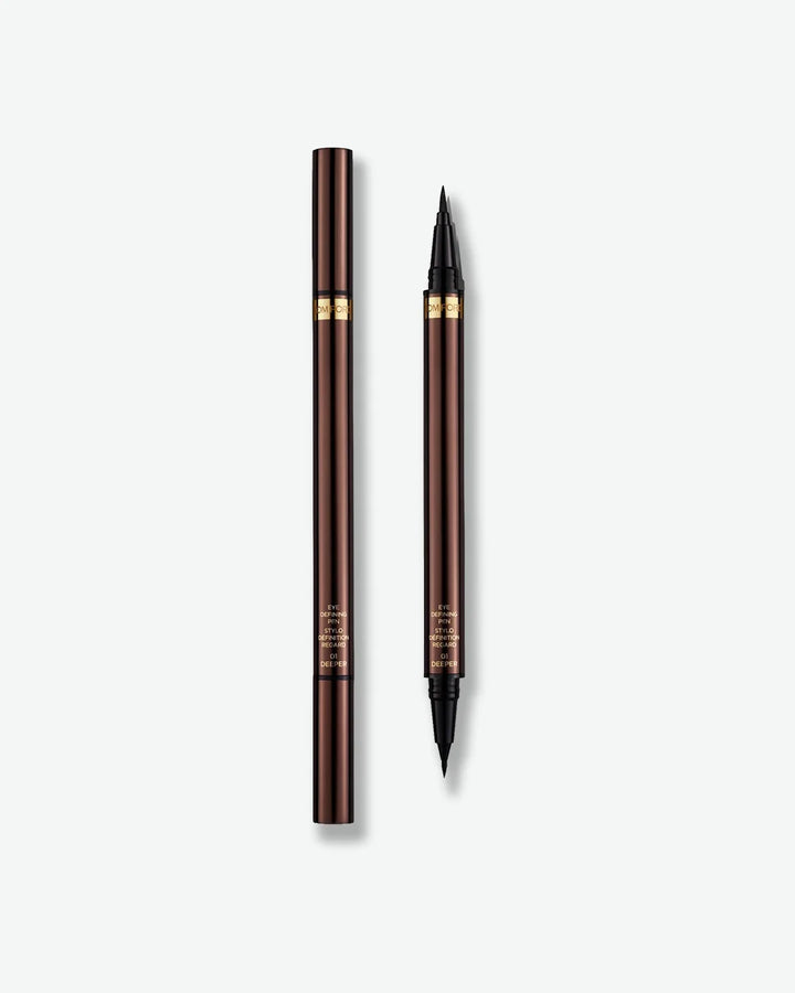 Two brown eyeliner pencils on a white background