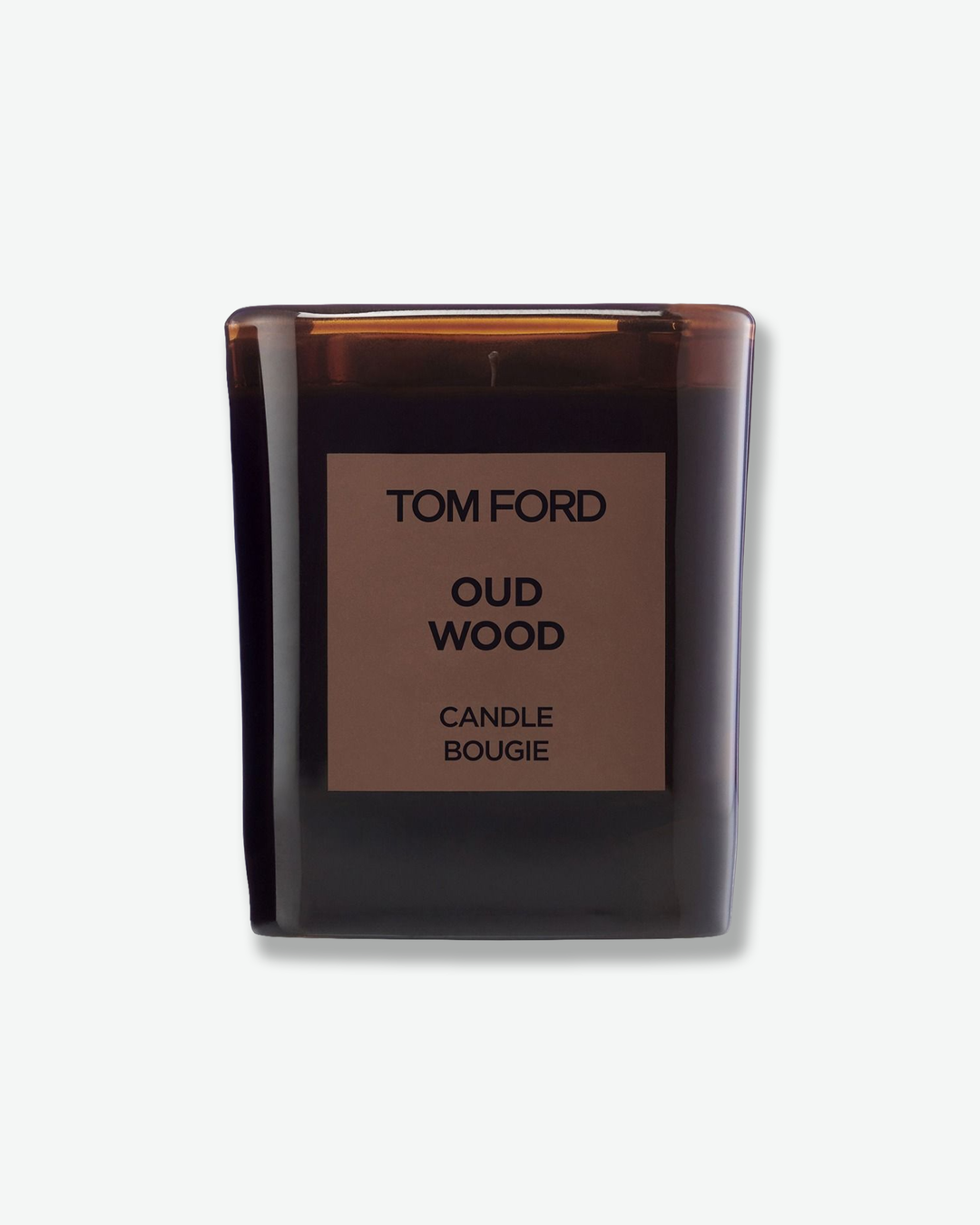 Tom Ford Oud Wood candle in a dark glass container on a white background