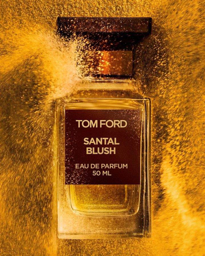 Tom Ford Santal Blush perfume bottle on a gold textured background