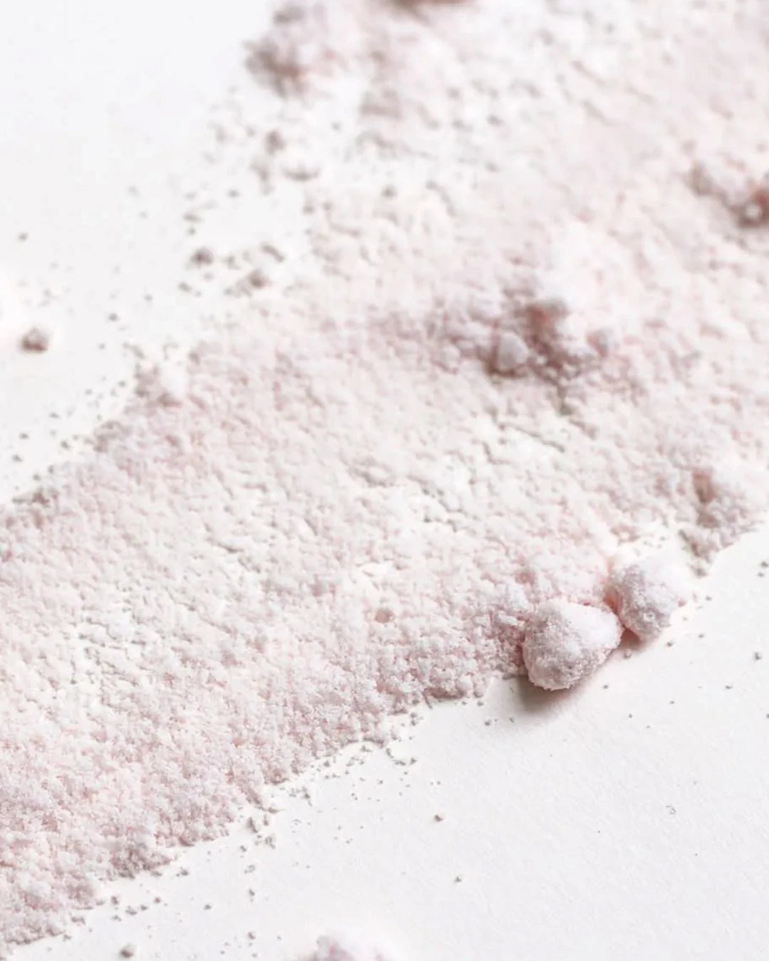 Close-up of pinkish powder on a white background