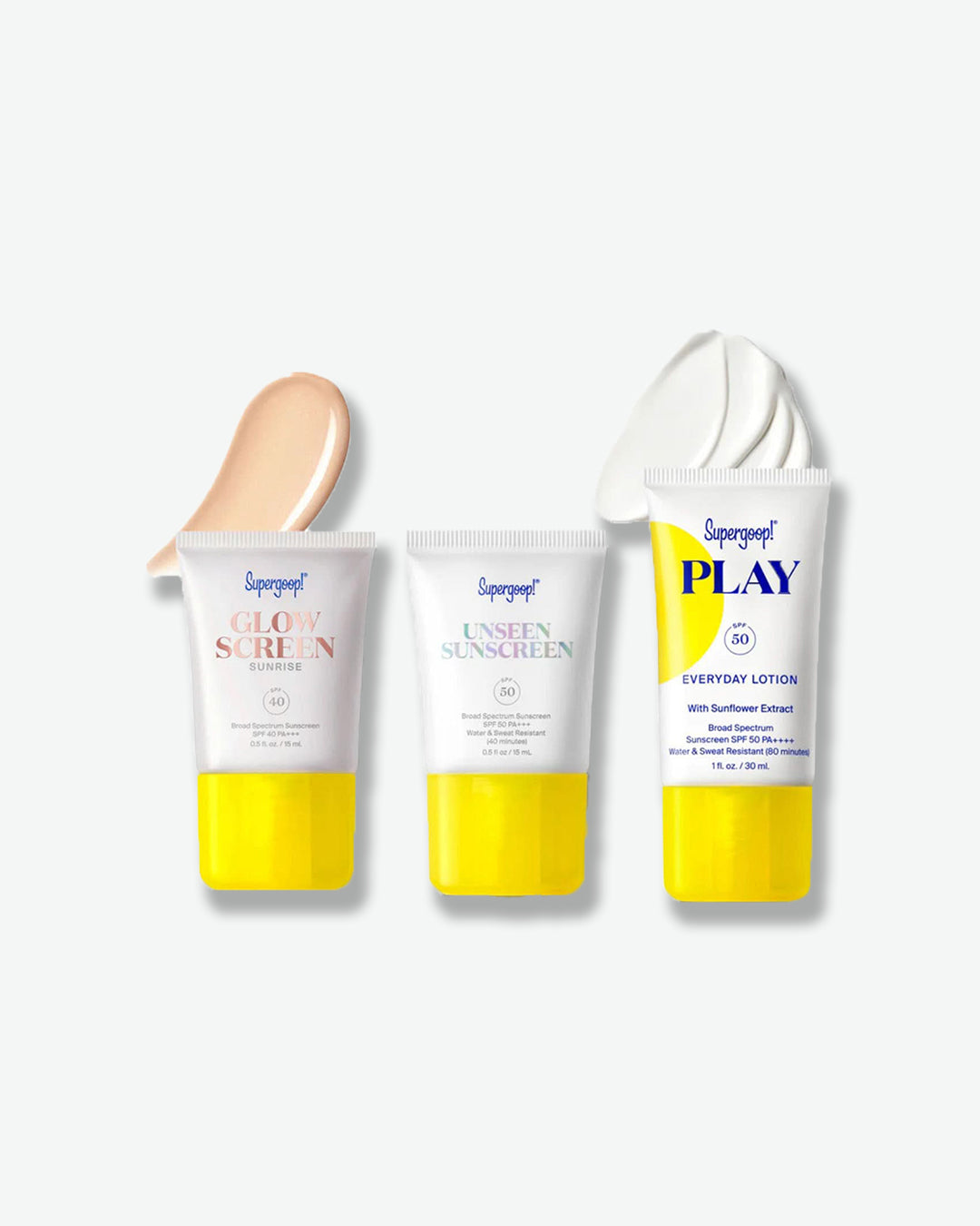A product shot of the Supergoop! "Icons Only" SPF Bestsellers Kit on a light grey background. At the top, three tubes stand in a row: Glow Screen Sunrise SPF 40, Unseen Sunscreen SPF 40, and PLAY Everyday Lotion SPF 50 with Sunflower Extract. Below the tubes is the bright yellow rectangular gift box featuring the same three products printed on it under the bold text "ICONS ONLY SPF BESTSELLERS KIT."