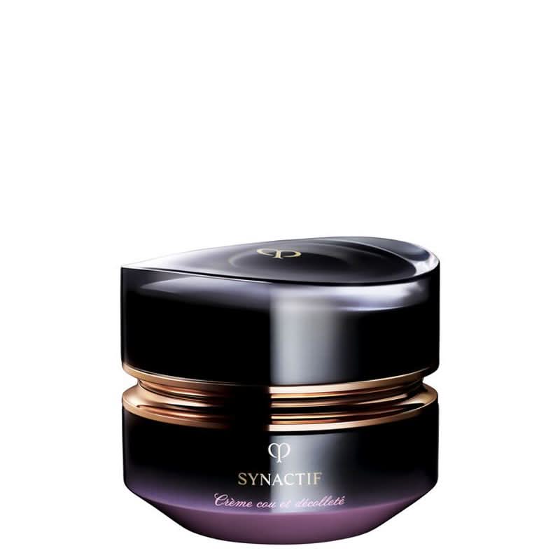Cosmetic jar with black and gold design on a white background